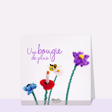 Bougie color&eacute;e et fleurs pour un anniversaire joyeux