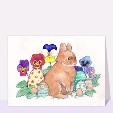 Lapin mignon parmi les fleurs et &oelig;ufs