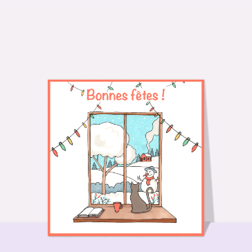 Bonnes f&ecirc;tes &agrave; travers la fen&ecirc;tre enneig&eacute;e