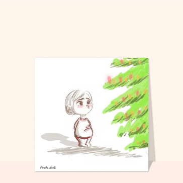 Enfant &eacute;merveill&eacute; devant le sapin de No&euml;l