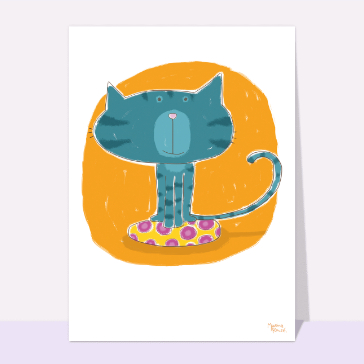 Chat joyeux sur un coussin color&eacute;