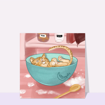Chat joyeux dans un bol de p&acirc;tisseries