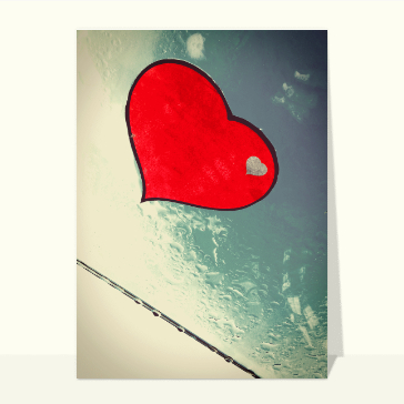 Carte St Valentin street art : Coeur sur une vitre mouillée
